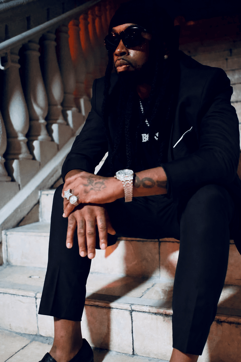 The Nappy Chef in a black suit